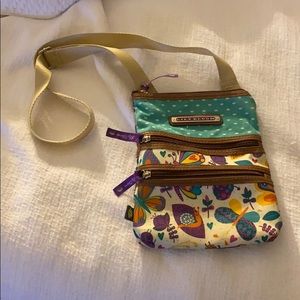 Cross body lily bloom purse .